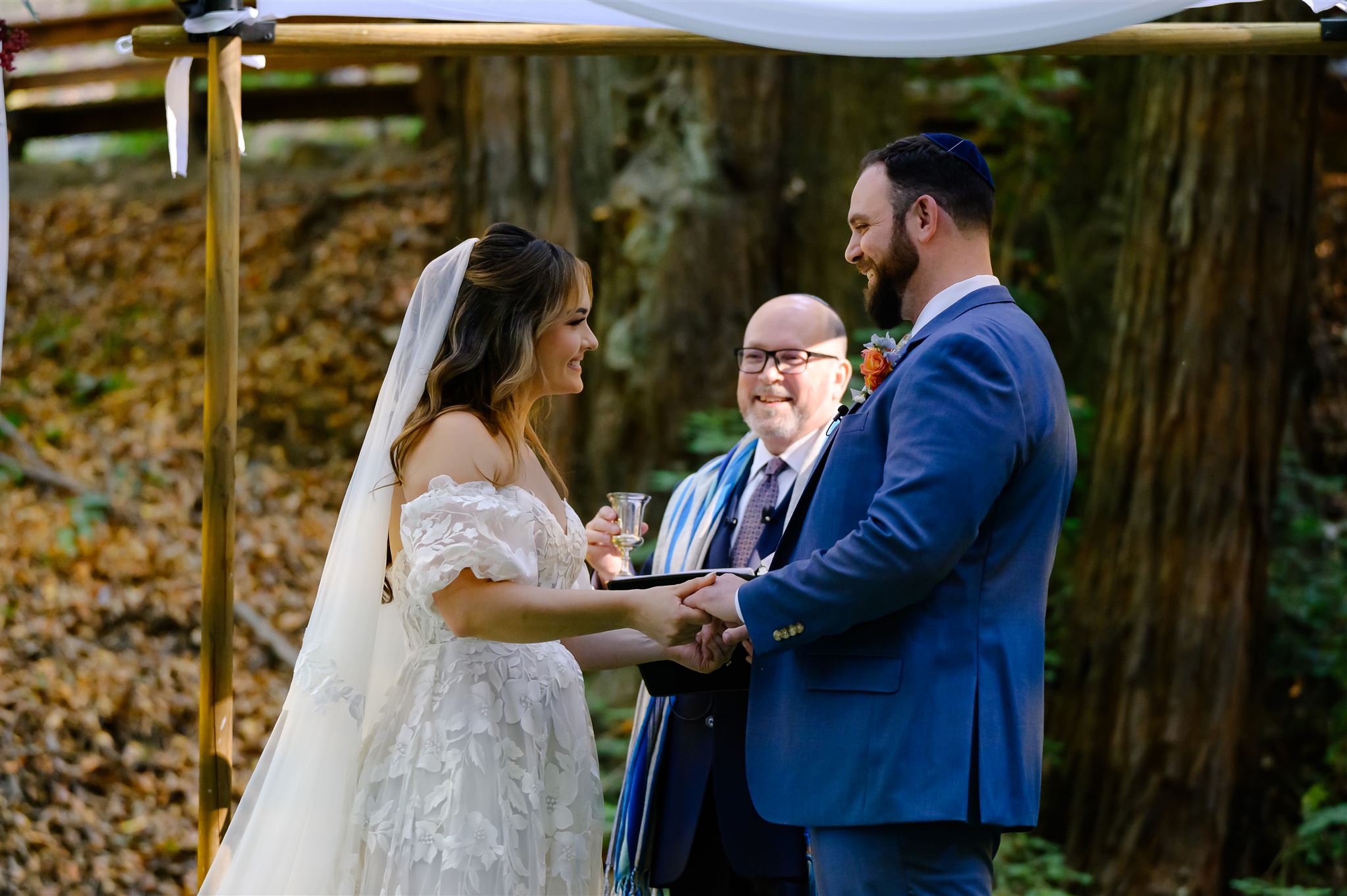 Howard, bride and groom at the altar