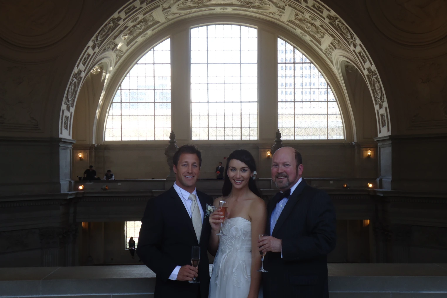 Howard with Bride and Groom with champagne